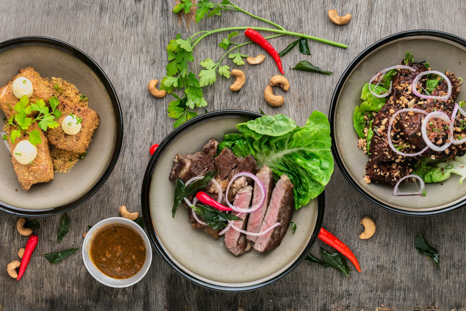 An overhead spread of colorful dishes on a table
